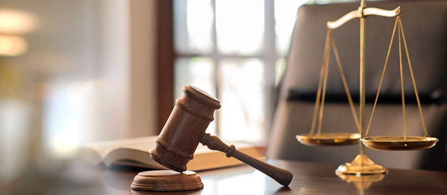 Legal office with scales of justice on desk