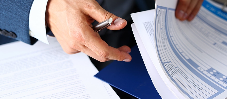 Property Insurance claim paperwork being reviewed