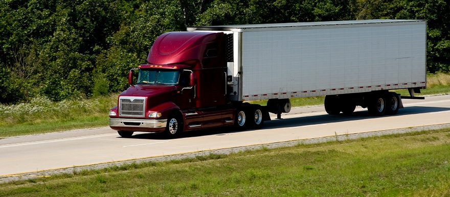 Tractor Trailer driving on freeway